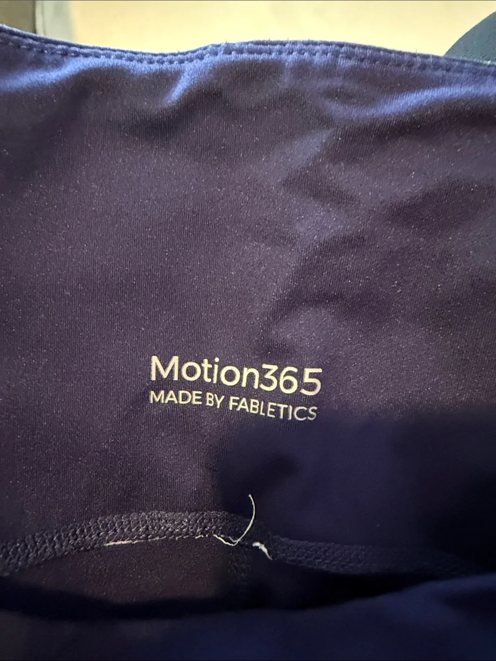 Woman’s fabletics navy Leggings with Lime Side Stripes. No tag but fits like a S